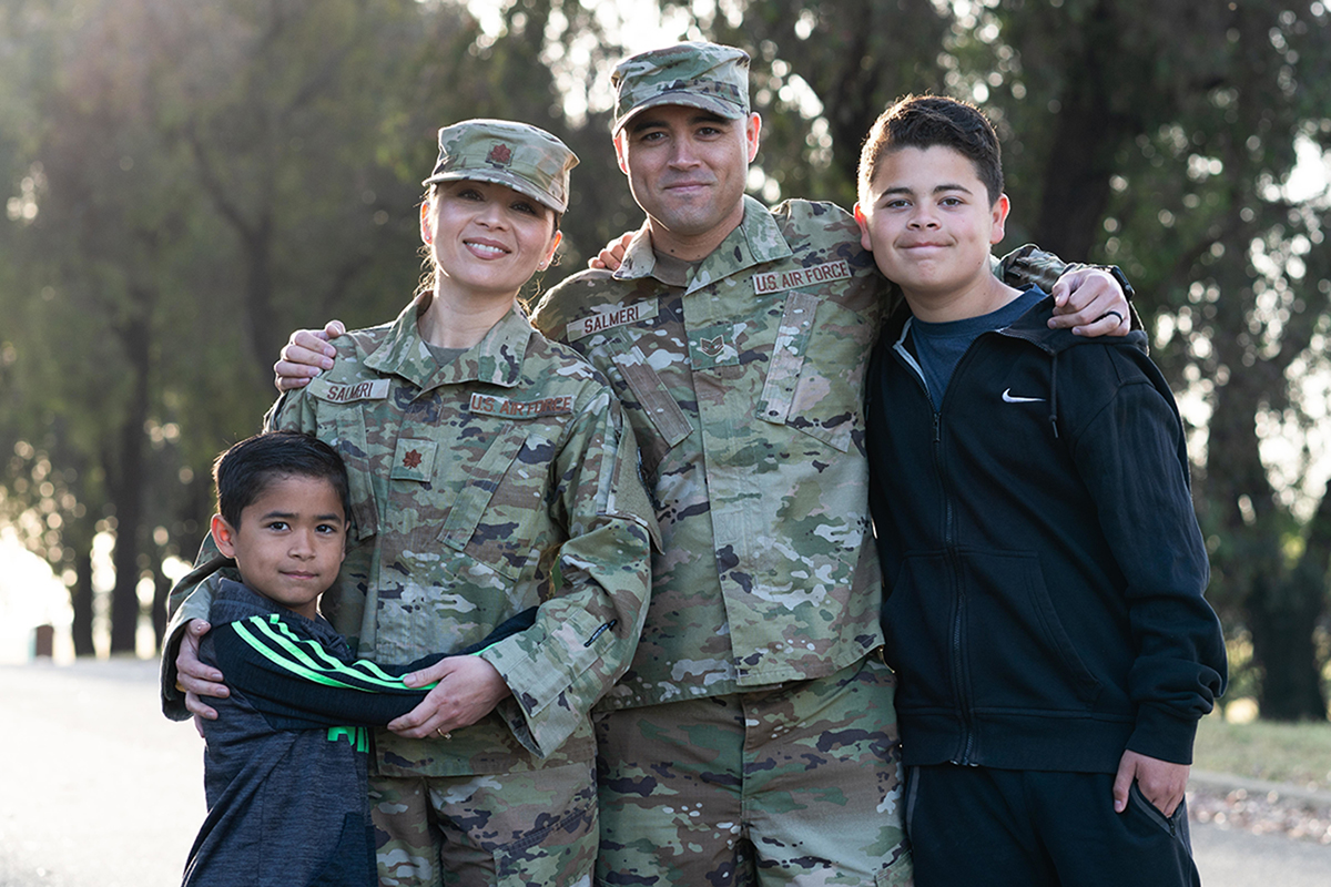 U.S. Air Force Maj. Sara Salmeri, 60th Medical Group TRICARE Operations flight commander, and Tech. Sgt. Peter Salmeri, 60th Communication Squadron cyber systems supervisor, pose for a photo with their children for the Military Spouse Appreciation Day campaign at Travis Air Force Base, California, April 7, 2022. May 6th is Military Spouse Appreciation Day and Travis AFB is celebrating by highlighting the resiliency and commitment of spouses in the military community. (U.S. Air Force photo by Chustine Minoda)
